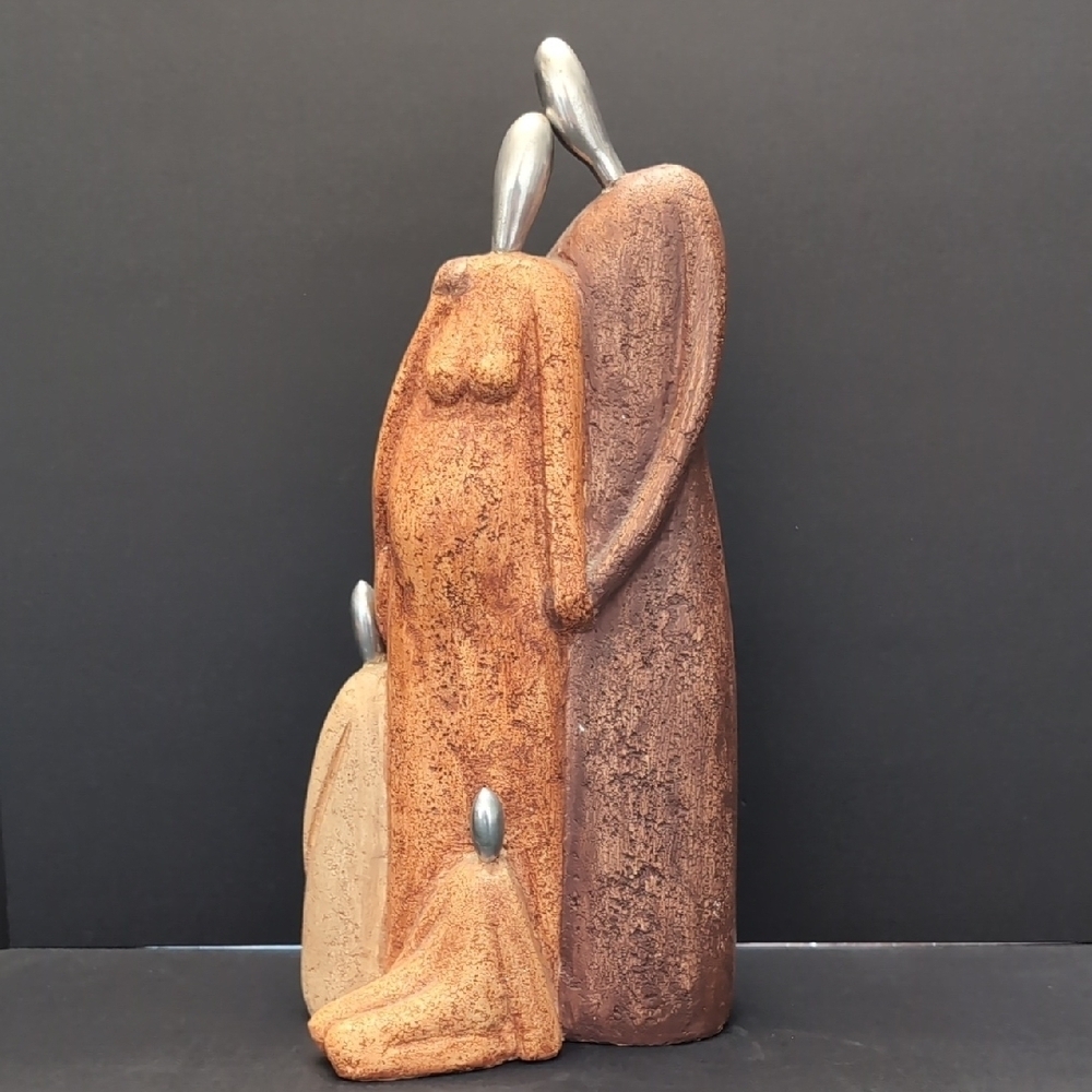 MCM Sculpture Of Posing Family With Silver Heads.